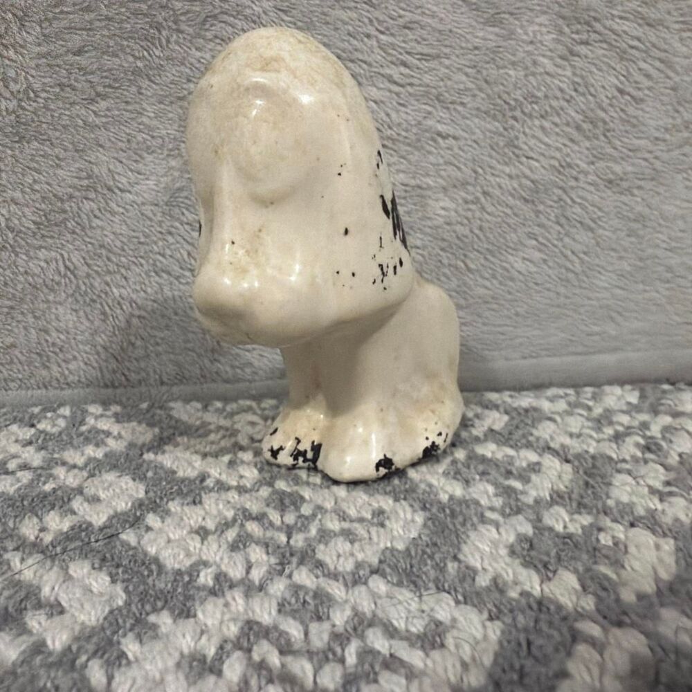 Creepy looking basset hound figure